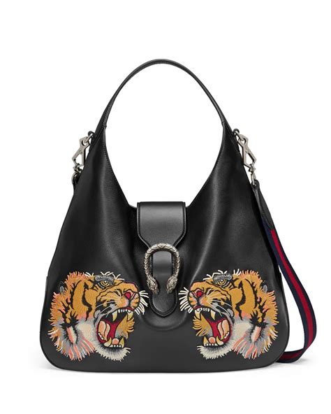 yellow gucci purse with tiger emblem